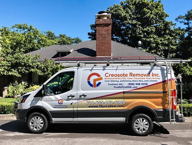 Guilford Chimney Sweep technician removing creosote safely in Guilford, CT