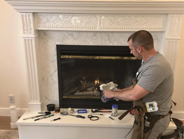 Guilford Chimney Sweep performing fireplace maintenance in Guilford, CT